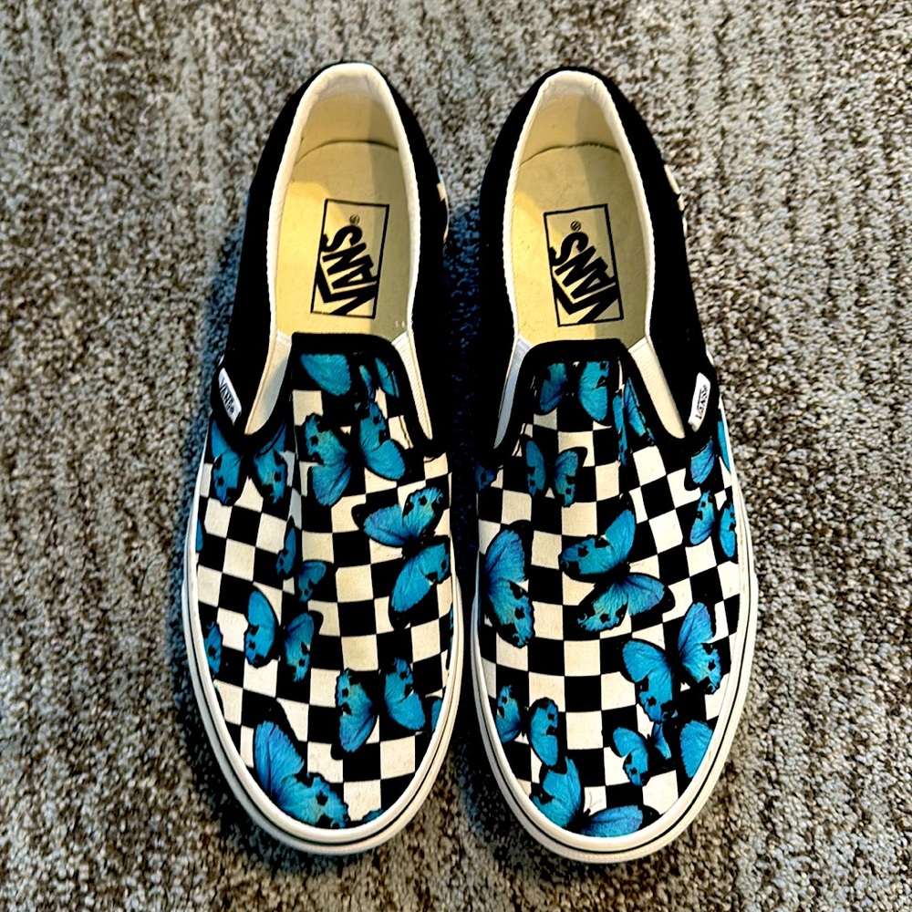 Black and white checkered vans with blue butterflies